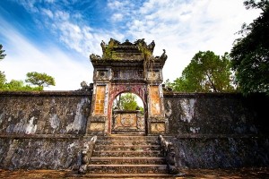 An old mossy arch gate inside Tu Duc tomb area. Tu Duc tomb, Thua Thien Hue, Vietnam, Asia 2012.